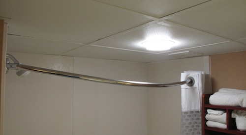 Curved shower curtain rod